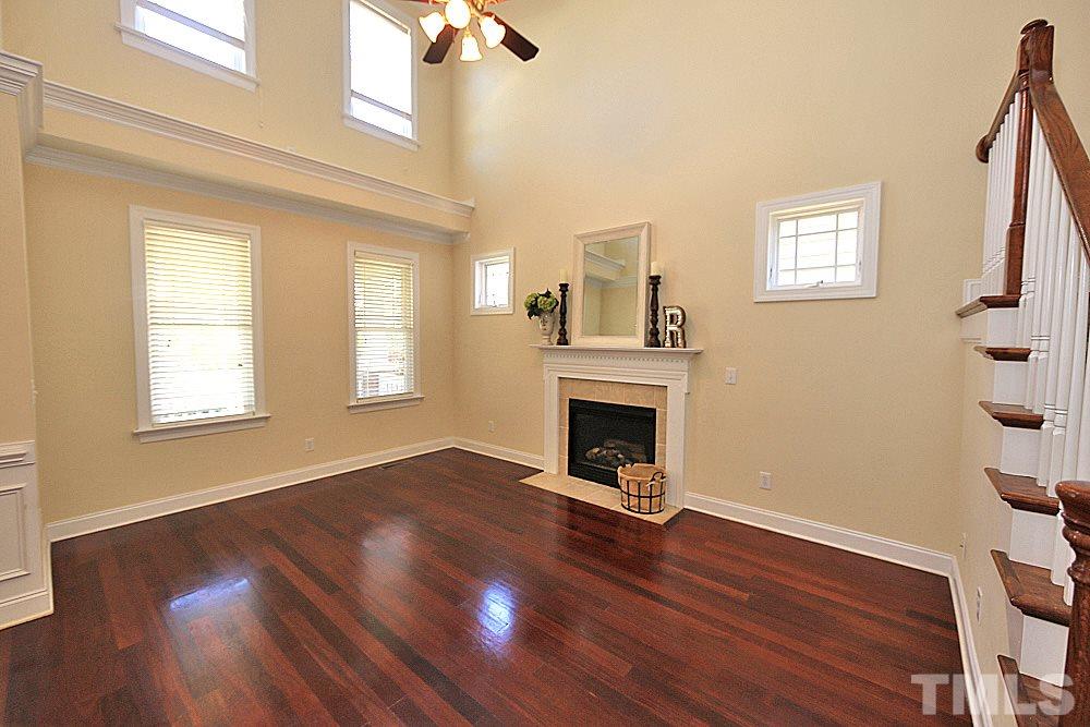 2108 Karns Place Raleigh, NC 27614 - Photo 3 of 26 a view of empty room with wooden floor and fan