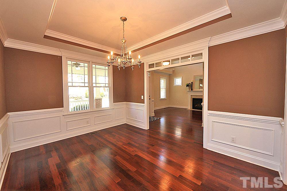 2108 Karns Place Raleigh, NC 27614 - Photo 6 of 26 a view of an empty room with window and wooden floor