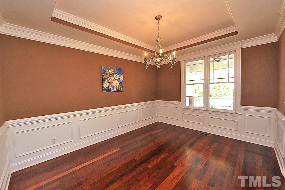 2108 Karns Place Raleigh, NC 27614 - Photo 7 of 26 a view of an empty room with wooden floor and a window