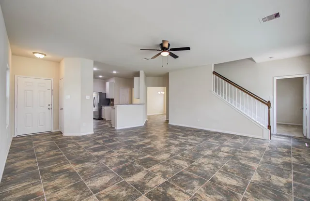 a view of a livingroom with a kitchen
