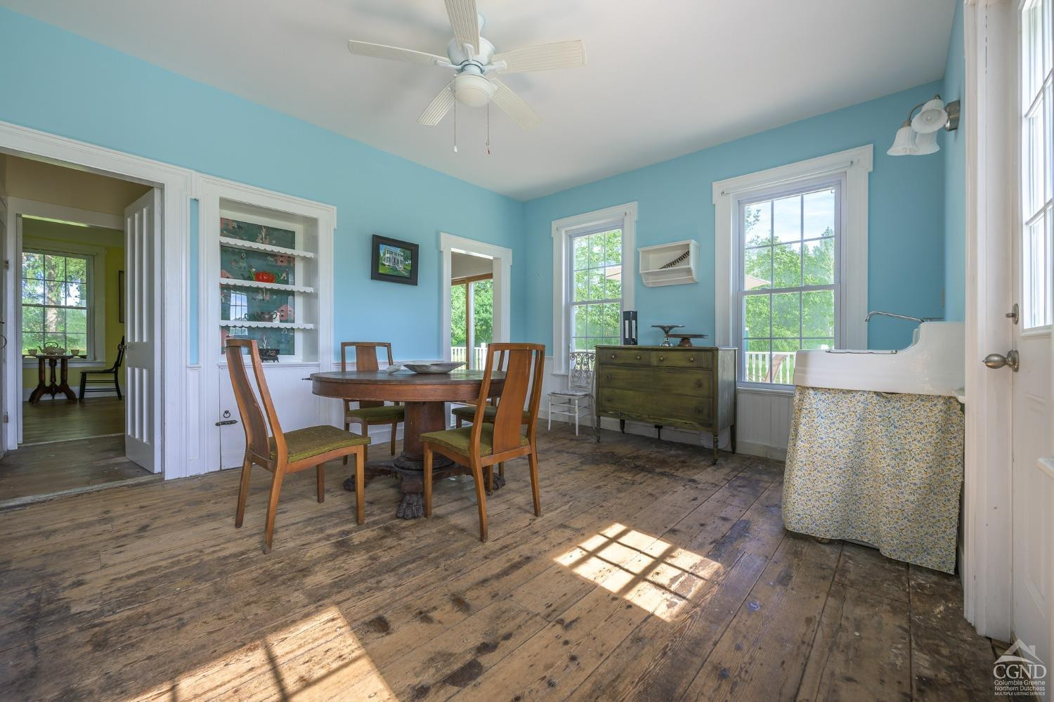 235 Slate Hill Road Ghent, NY 12037 - Photo 14 of 38 a view of a dining room with furniture window and wooden floor
