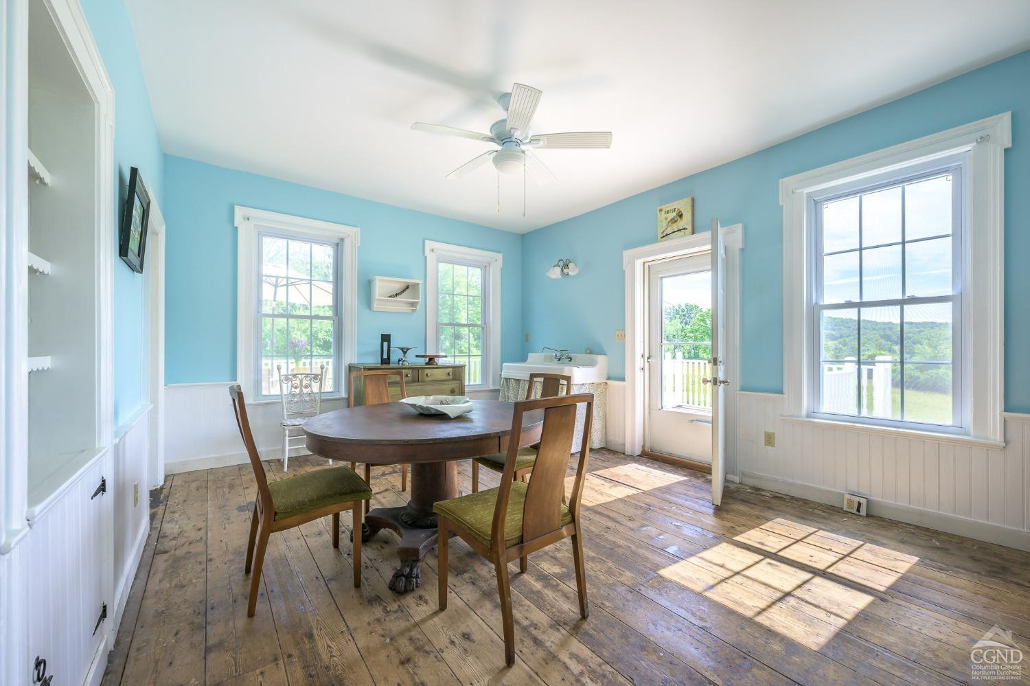 235 Slate Hill Road Ghent, NY 12037 - Photo 15 of 38 a view of a dining room with furniture window and wooden floor