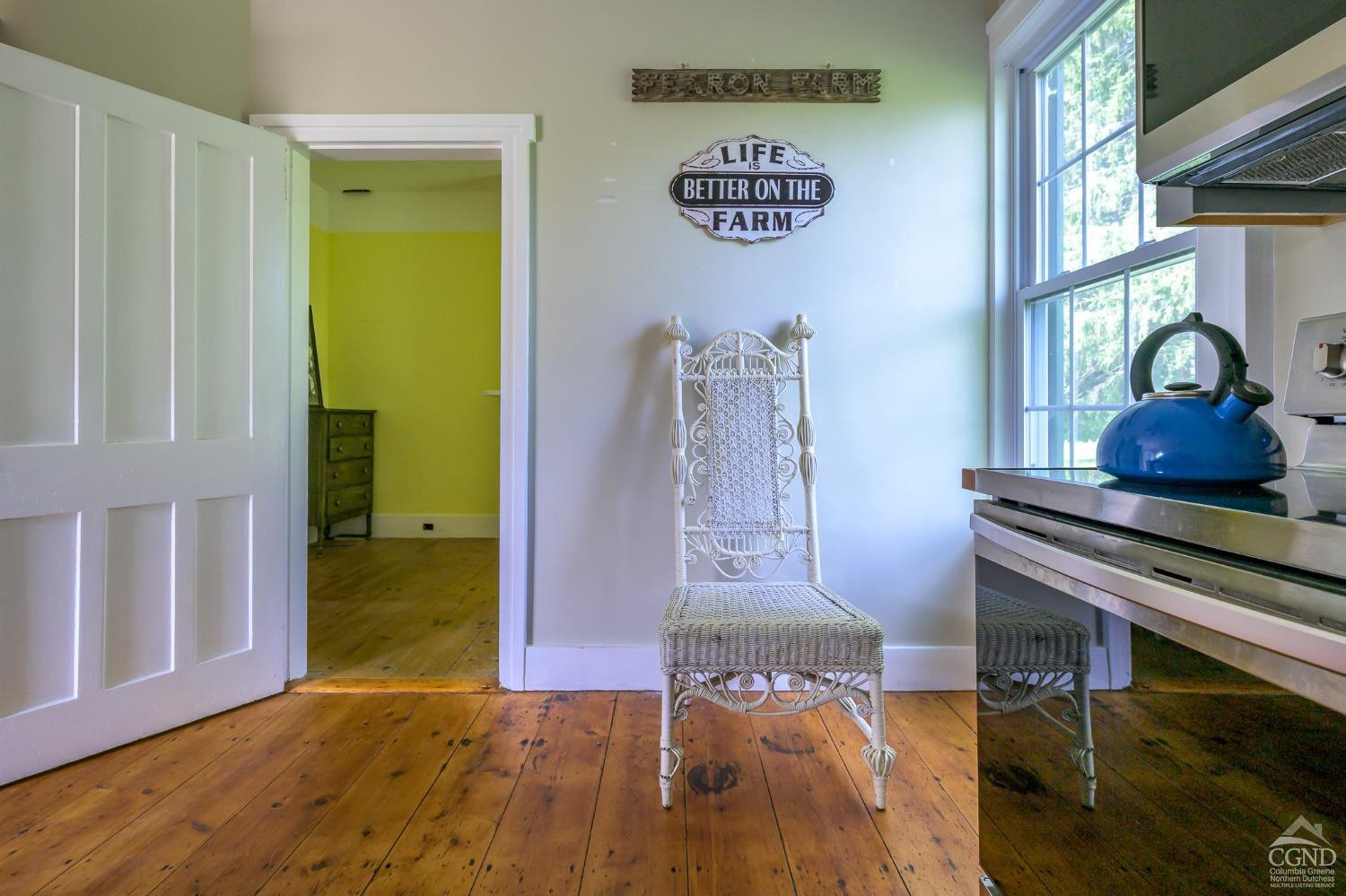 235 Slate Hill Road Ghent, NY 12037 - Photo 17 of 38 a view of a room with wooden floor and windows