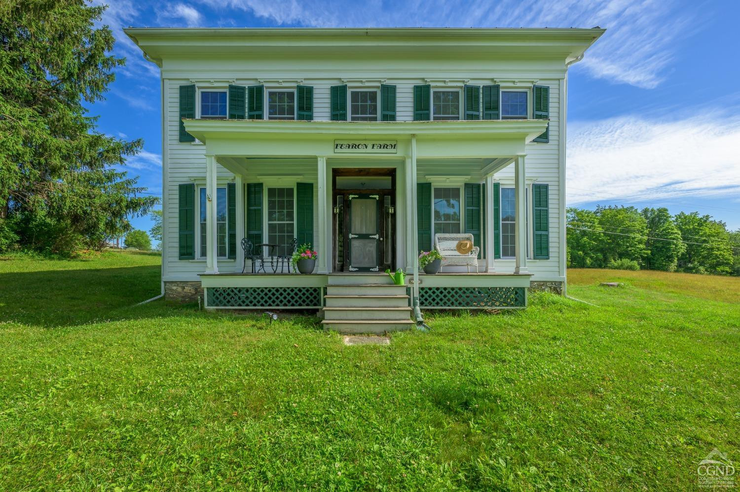 235 Slate Hill Road Ghent, NY 12037 - Photo 2 of 38 front view of a brick building with a yard