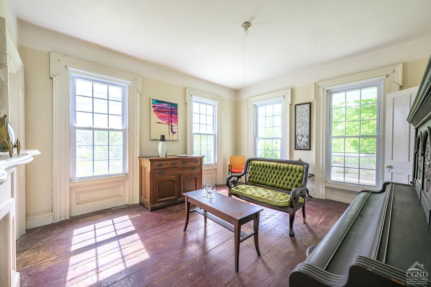 235 Slate Hill Road Ghent, NY 12037 - Photo 22 of 38 a living room with furniture and a window