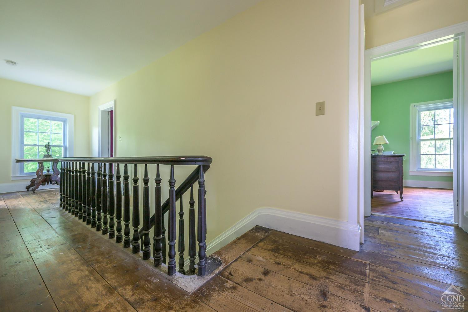 235 Slate Hill Road Ghent, NY 12037 - Photo 24 of 38 a view of a hallway view with wooden floor and staircase