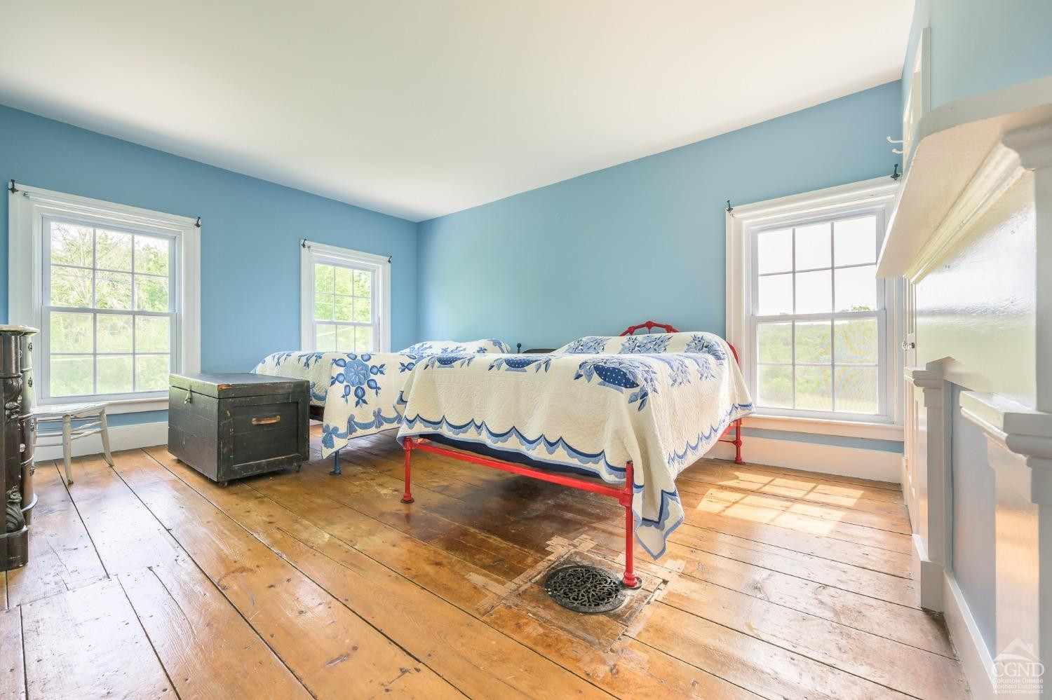 235 Slate Hill Road Ghent, NY 12037 - Photo 28 of 38 a bedroom with a bed and wooden floor