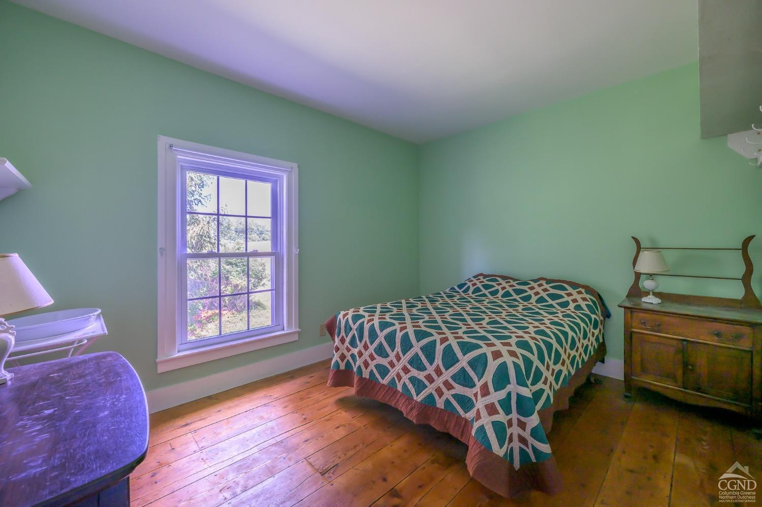 235 Slate Hill Road Ghent, NY 12037 - Photo 30 of 38 a bedroom with a bed and window