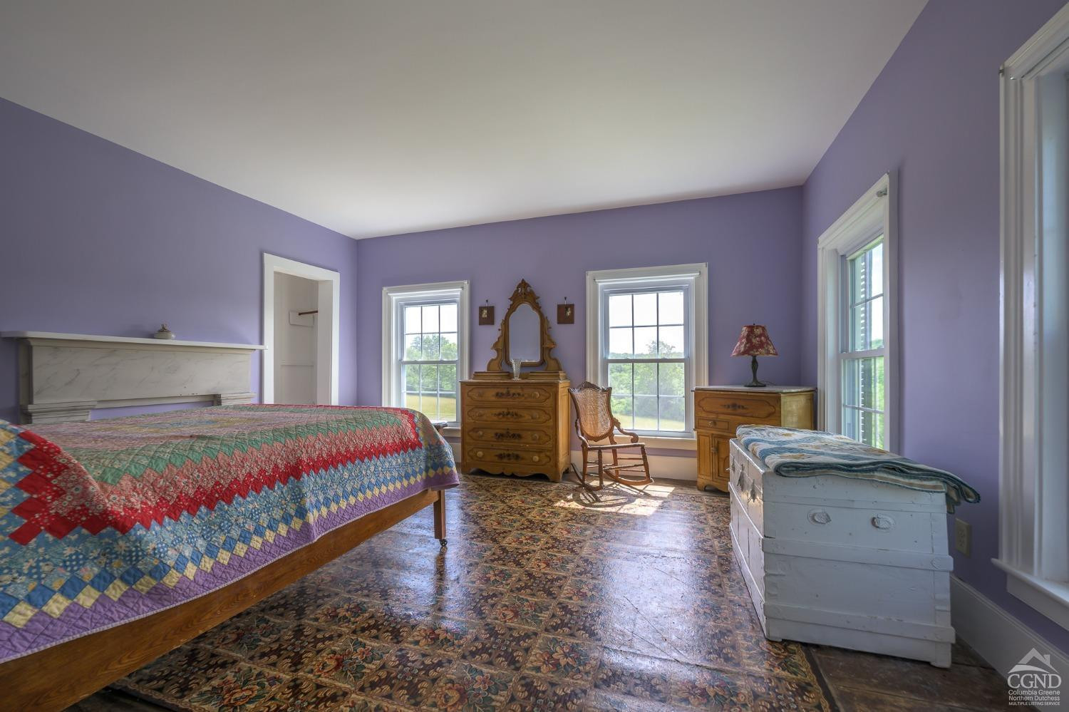 235 Slate Hill Road Ghent, NY 12037 - Photo 31 of 38 a bedroom with a bed and wooden floor