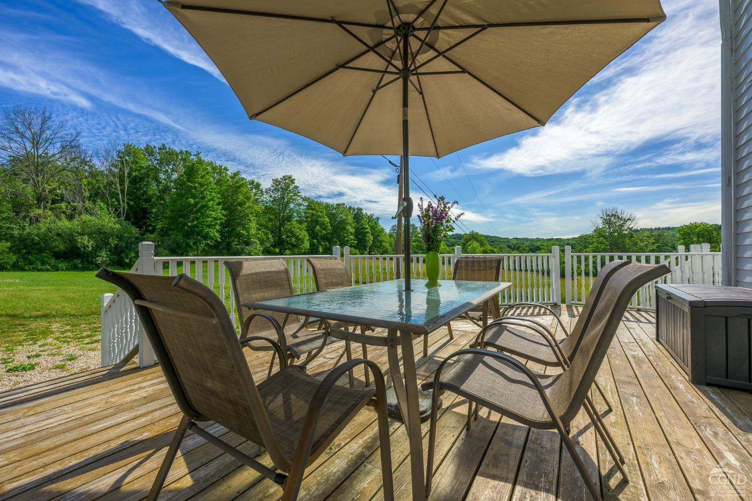 235 Slate Hill Road Ghent, NY 12037 - Photo 10 of 38 a view of a roof deck with furniture and a yard