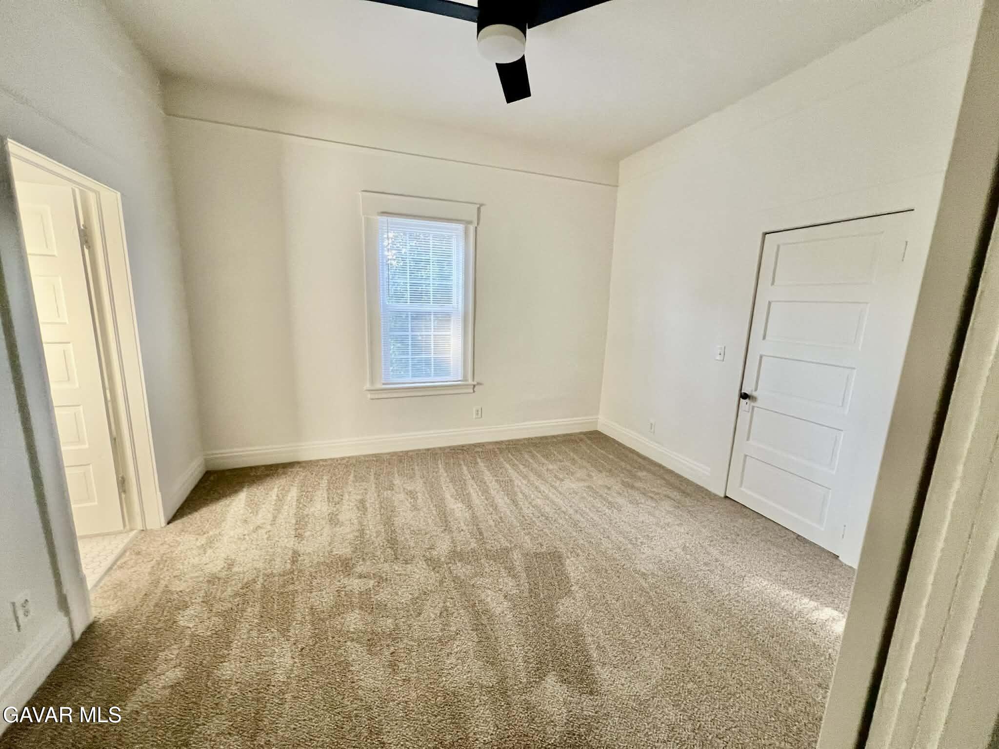 2702 19th Street Bakersfield, CA 93301 - Photo 7 of 21 an empty room with windows