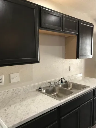a bathroom with a sink vanity and mirror
