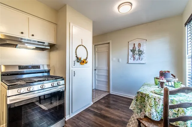 a view of kitchen with furniture and wooden floor