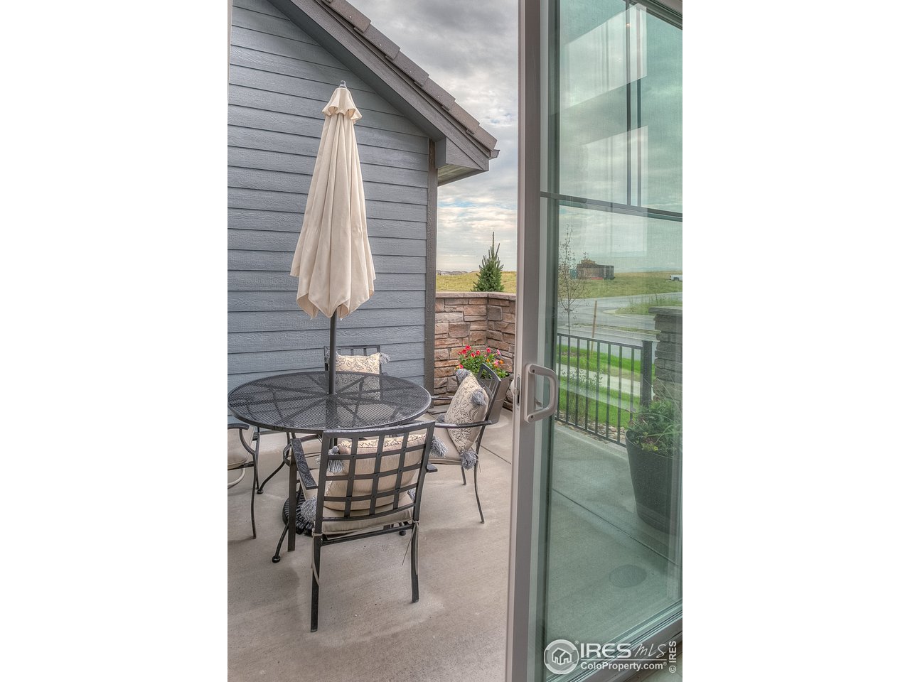 1547 Stoneseed Street Berthoud, CO 80513 - Photo 20 of 39 a balcony with a couch and table