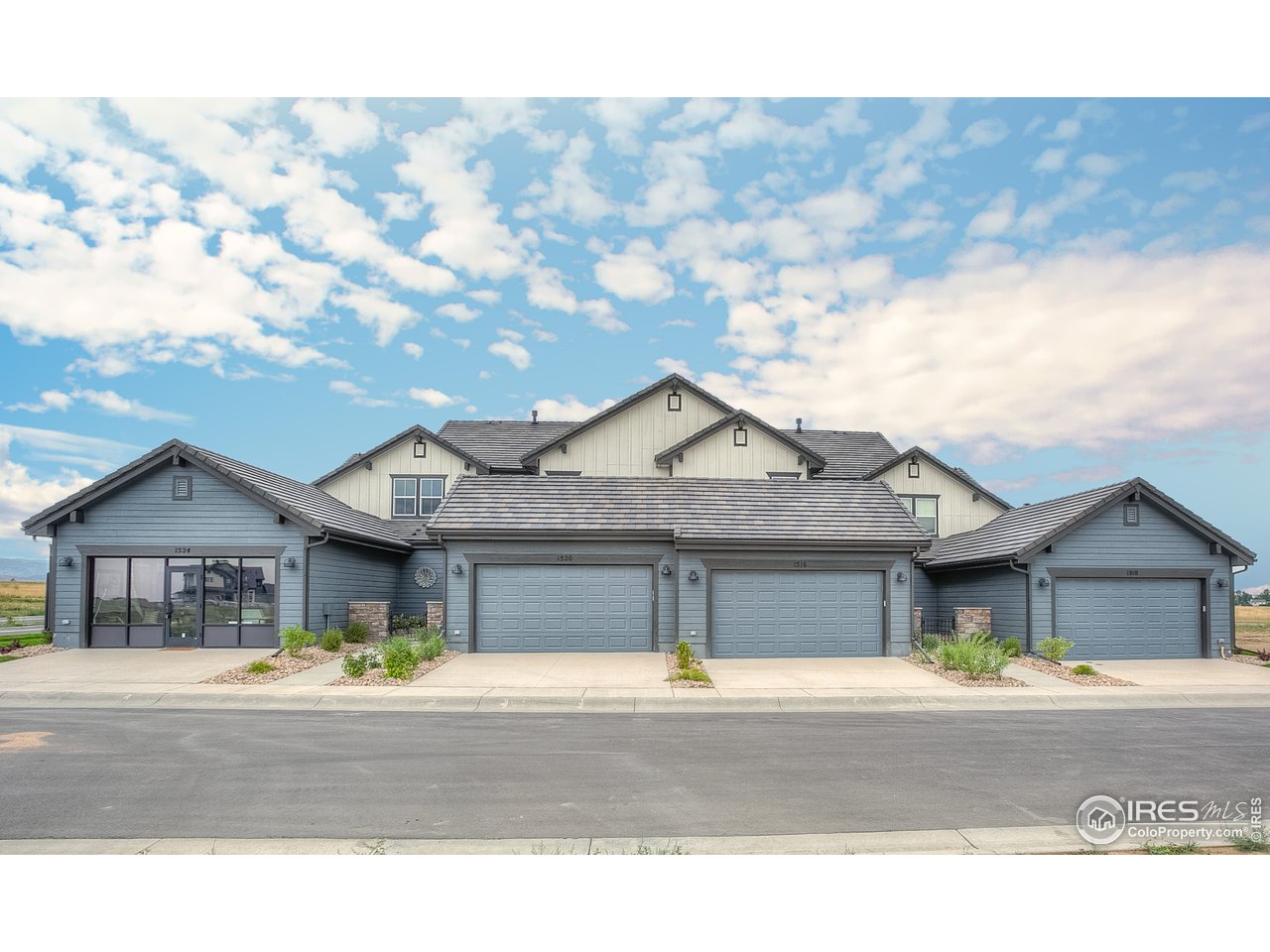 1547 Stoneseed Street Berthoud, CO 80513 - Photo 3 of 39 a front view of a house with a garden and pathway