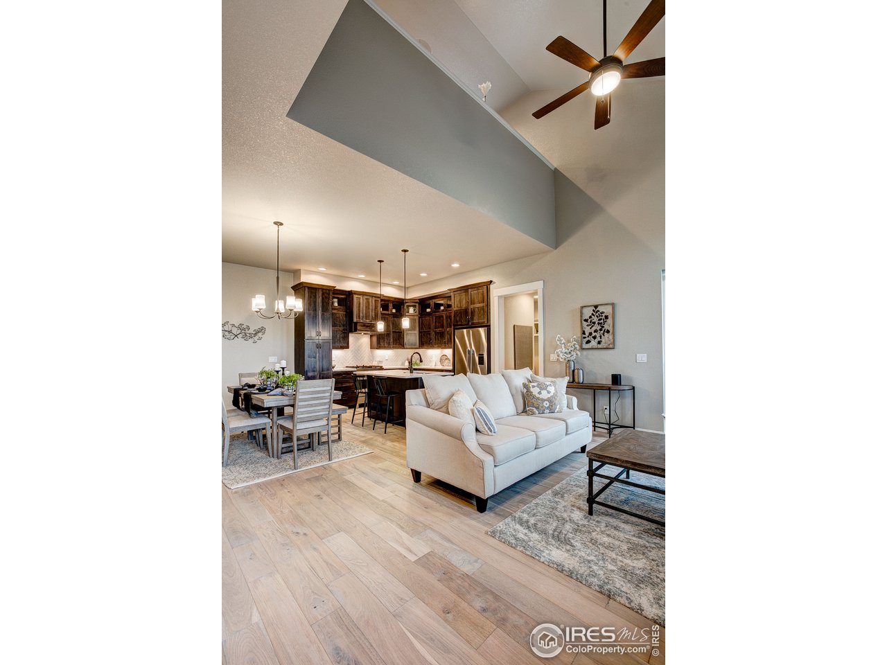 1547 Stoneseed Street Berthoud, CO 80513 - Photo 5 of 39 a living room with furniture and a wooden floor