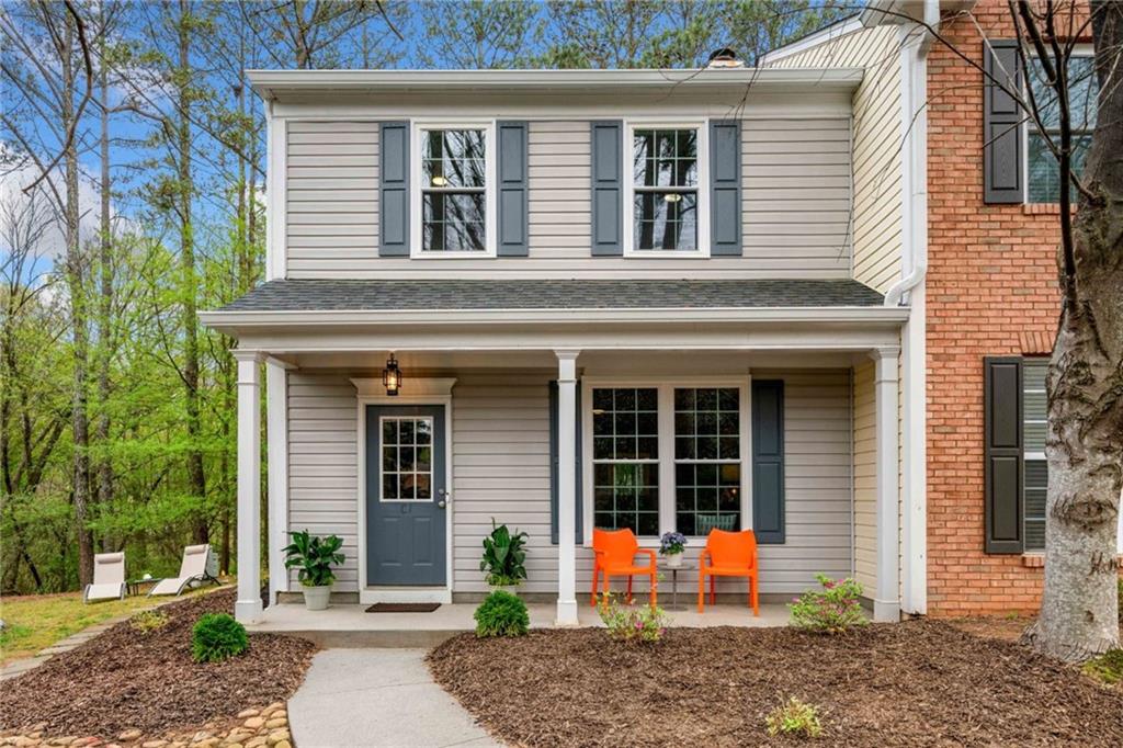 10900 Wittenridge Drive, Unit C1 Alpharetta, GA 30022 - Photo 1 of 1 a view of a house with chair and a fire pit