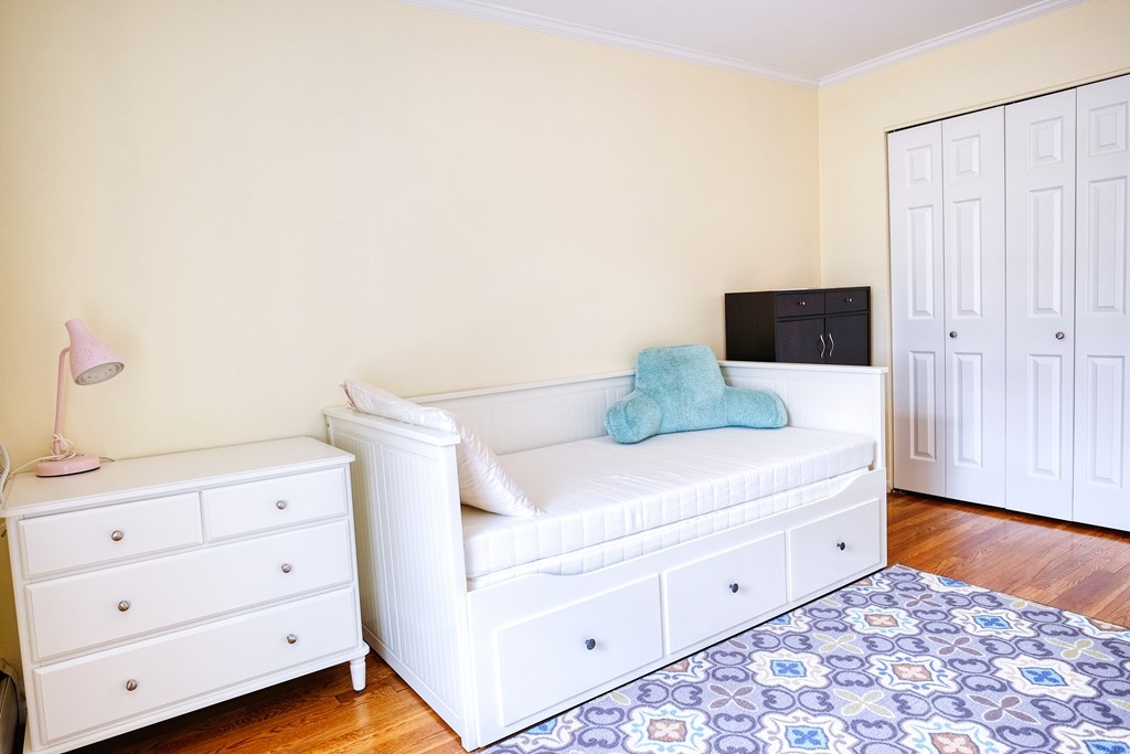 16 Addington Road, Unit 41 Brookline, MA 02445 - Photo 11 of 18 a bedroom with a bed and a dresser