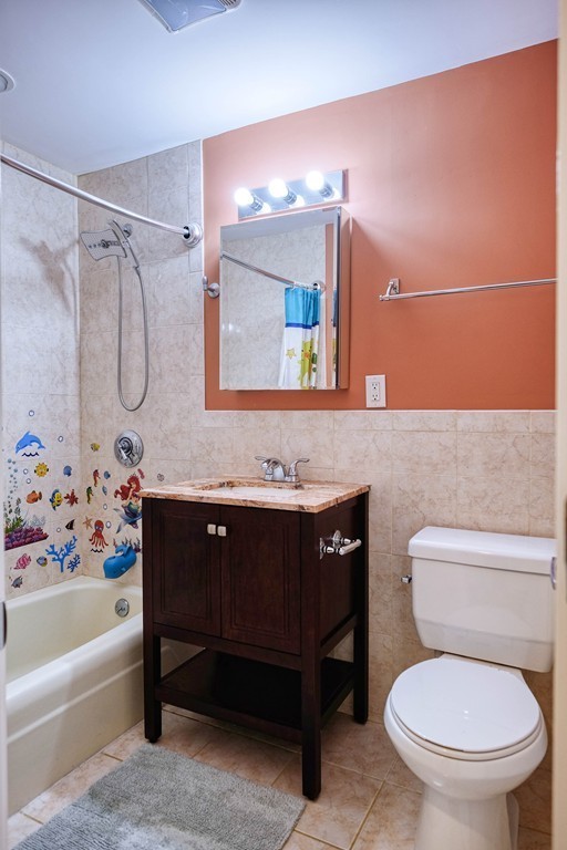 16 Addington Road, Unit 41 Brookline, MA 02445 - Photo 12 of 18 a bathroom with a sink a toilet and a bathtub