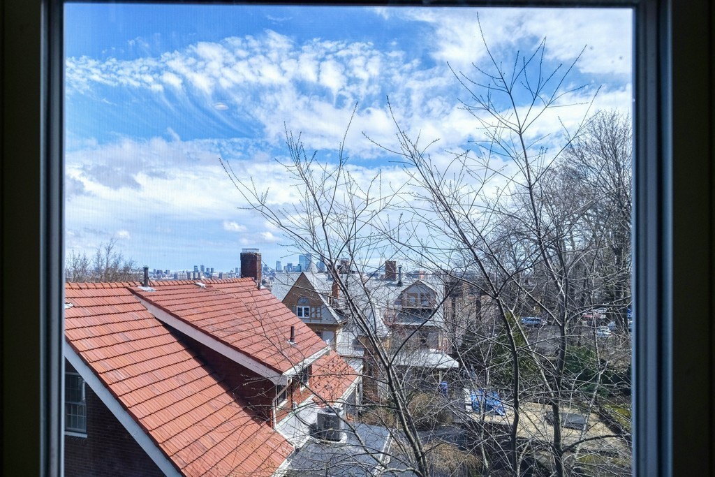 16 Addington Road, Unit 41 Brookline, MA 02445 - Photo 18 of 18 a view of a backyard with sitting area
