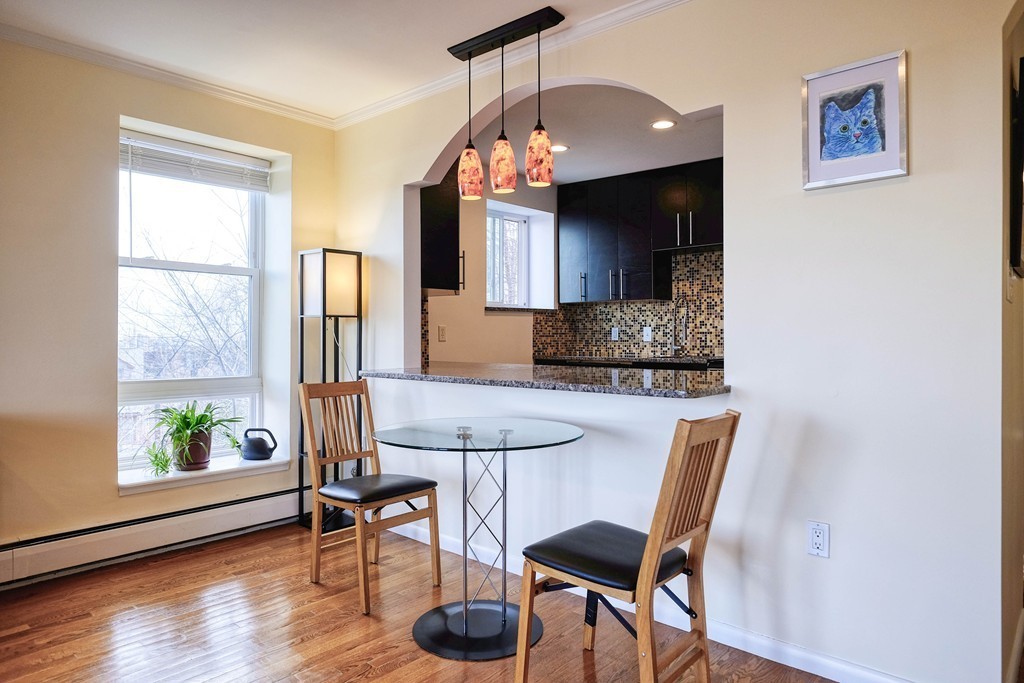 16 Addington Road, Unit 41 Brookline, MA 02445 - Photo 3 of 18 a view of a dining room with furniture window and wooden floor