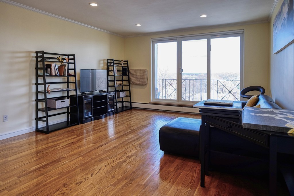 16 Addington Road, Unit 41 Brookline, MA 02445 - Photo 4 of 18 a living room with furniture and wooden floor
