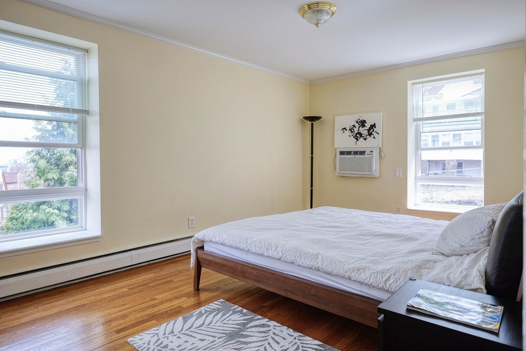 16 Addington Road, Unit 41 Brookline, MA 02445 - Photo 6 of 18 a bedroom with a bed and a window