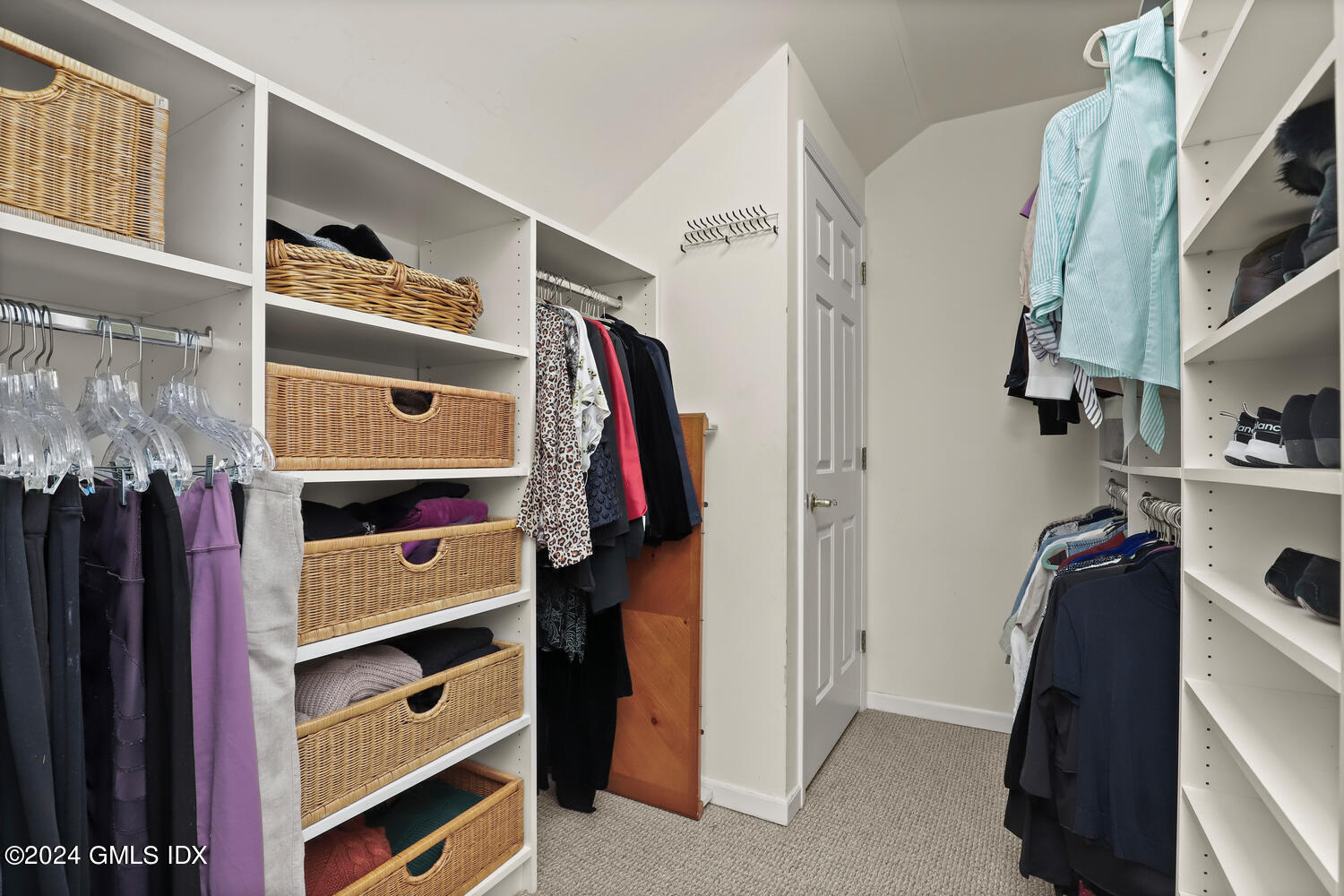 351 Pemberwick Road, Unit 915 Greenwich, CT 06831 - Photo 12 of 19 a view of walk in closet with clothes and shoes