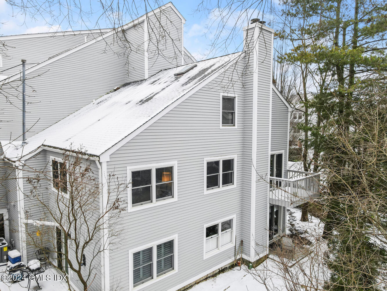 351 Pemberwick Road, Unit 915 Greenwich, CT 06831 - Photo 16 of 19 a view of a house with a yard
