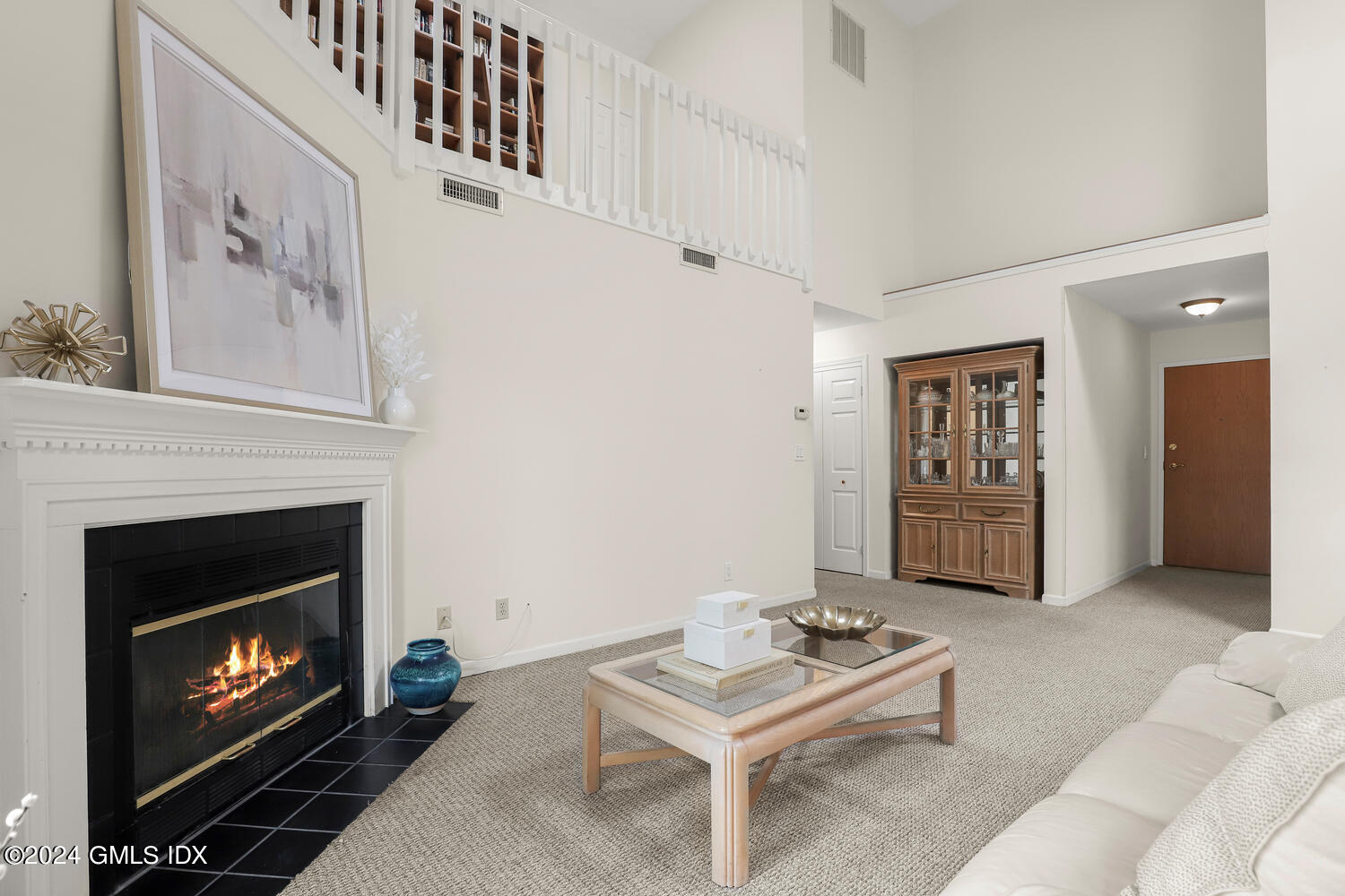 351 Pemberwick Road, Unit 915 Greenwich, CT 06831 - Photo 3 of 19 a living room with furniture and a fireplace