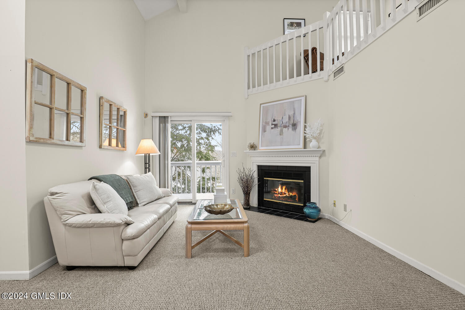 351 Pemberwick Road, Unit 915 Greenwich, CT 06831 - Photo 5 of 19 a living room with furniture and a fireplace