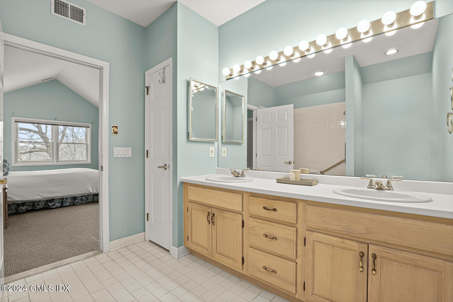 351 Pemberwick Road, Unit 915 Greenwich, CT 06831 - Photo 10 of 19 a spacious bathroom with a granite countertop double vanity sink a mirror and a shower