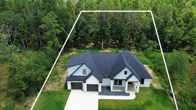 a aerial view of a house with pool