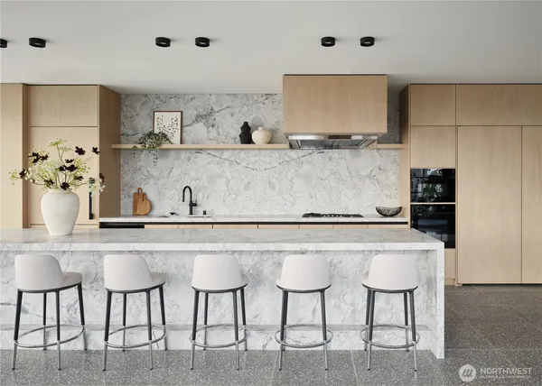 a kitchen with cabinets and chairs