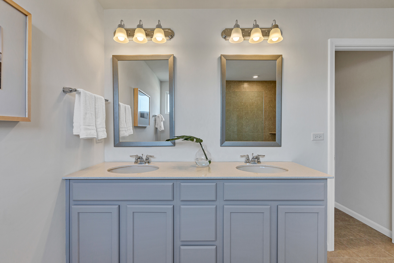 1702 Eastfield Drive Bartlett, IL 60103 - Photo 28 of 29 a bathroom with double vanity sinks and a mirror