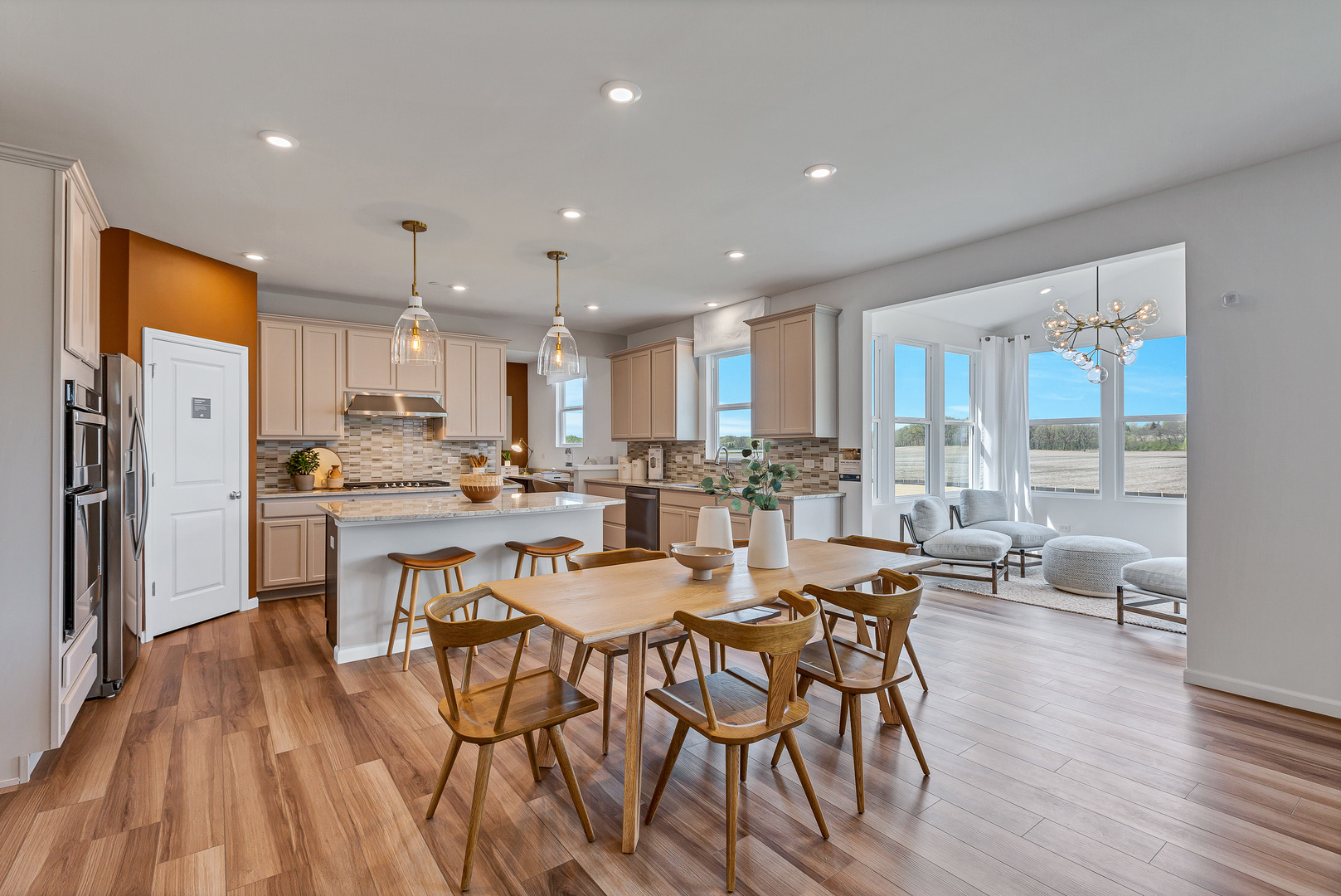 1702 Eastfield Drive Bartlett, IL 60103 - Photo 8 of 29 a dining room with stainless steel appliances a dining table chairs and view kitchen