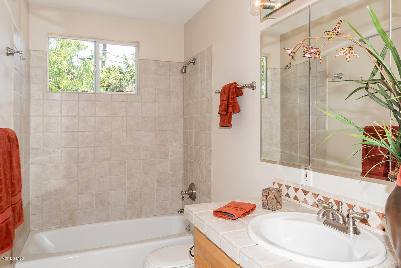 4204 Apricot Road Simi Valley, CA 93063 - Photo 14 of 20 a bathroom with a sink and a mirror