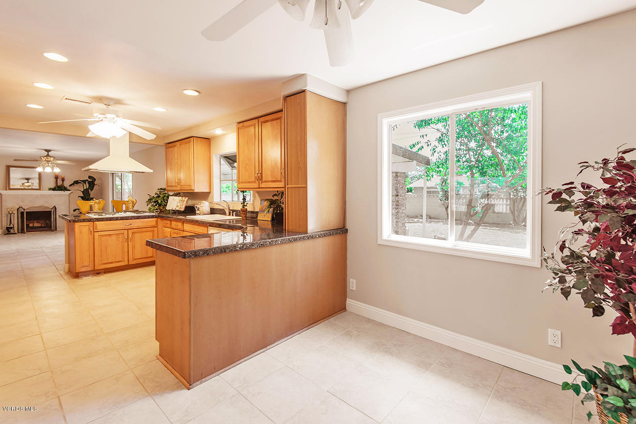 4204 Apricot Road Simi Valley, CA 93063 - Photo 6 of 20 a large kitchen with kitchen island a large window in it