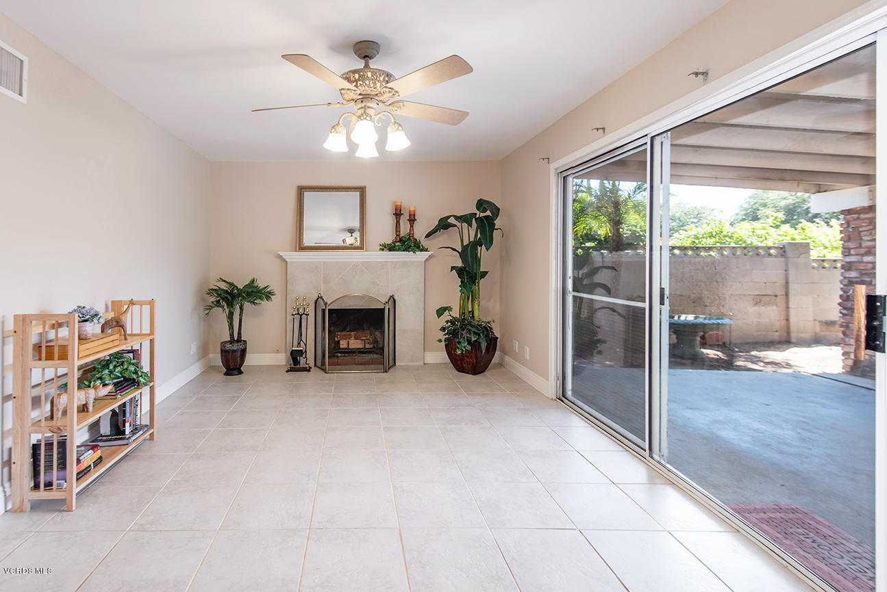 4204 Apricot Road Simi Valley, CA 93063 - Photo 8 of 20 a view of an empty room with a fireplace and a large window