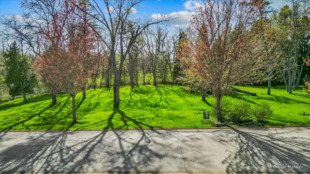 a view of a street with a bench in the background