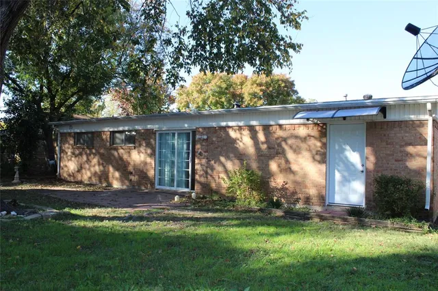 a view of a backyard with a garden and plants