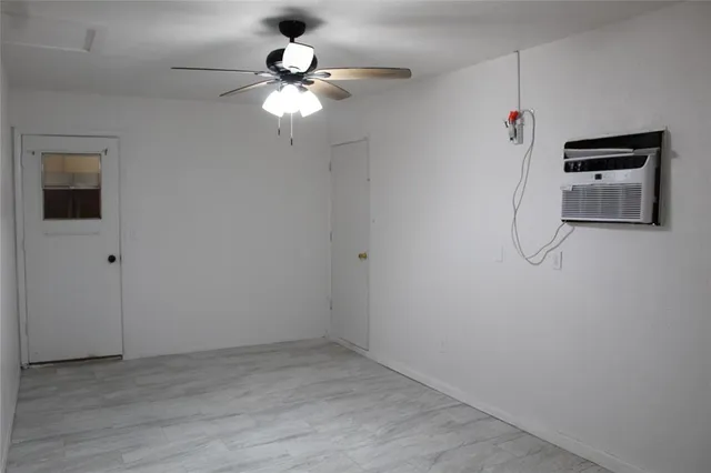 a view of a livingroom with a chandelier fan