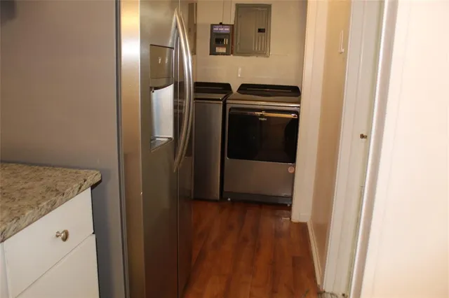 a view of a kitchen from the hallway