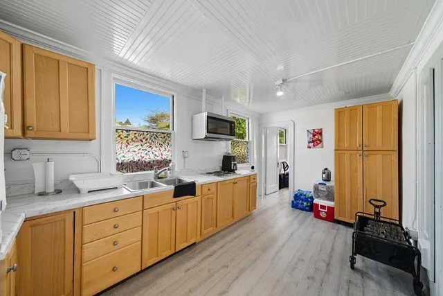 a bathroom with a sink mirror vanity and toilet