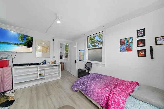 a view of a patio with table and chairs and potted plants