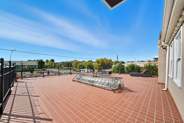 a view of a porch with furniture and yard