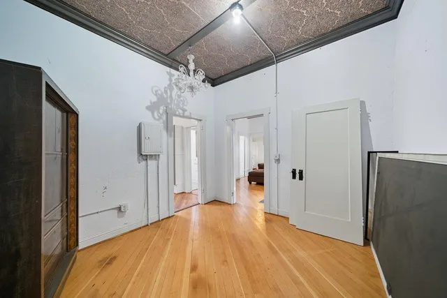 an aerial view of a house with a garden and street view