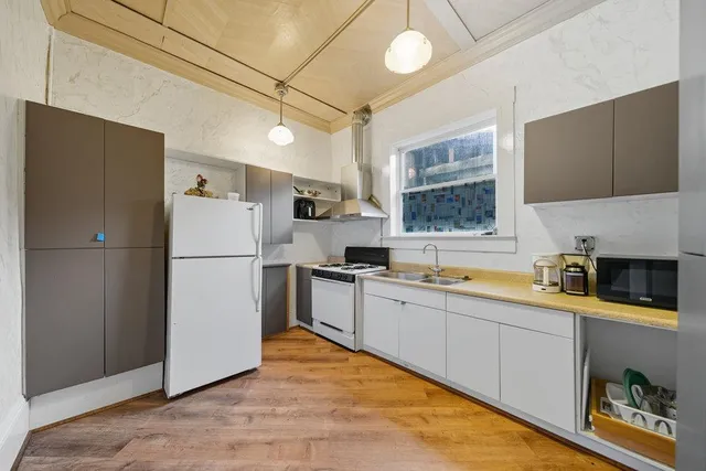 an aerial view of a house with a garden