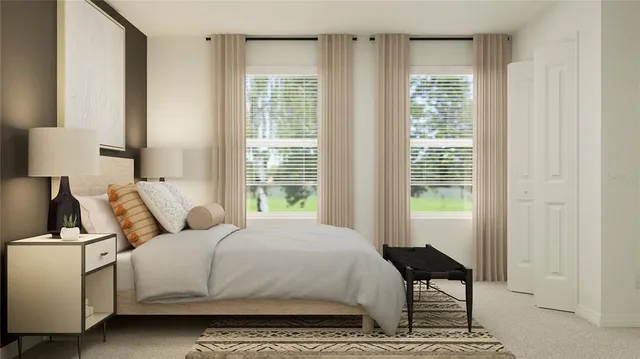 a bedroom with a bed and a window