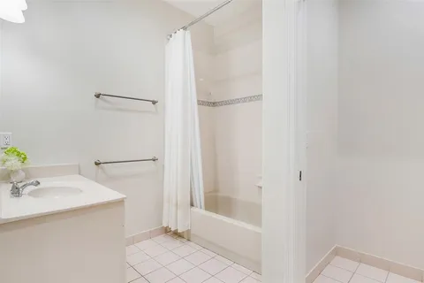 a bathroom with a bathtub and a sink